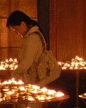 Photo of praying woman at Notre Dame, Paris
